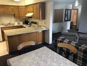 Suite, 1 King Bed, Kitchen | Private kitchen | Fridge, coffee/tea maker