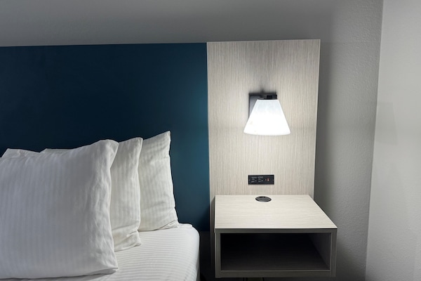 Premium bedding, pillowtop beds, desk, laptop workspace