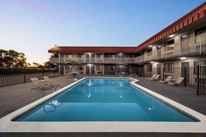 Outdoor pool, open 10 AM to 10 PM, pool umbrellas, pool loungers