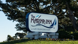 A sign for The Marina Inn on San Francisco Bay, featuring a bird and wave design. - The Marina Inn on San Francisco Bay (San Leandro)