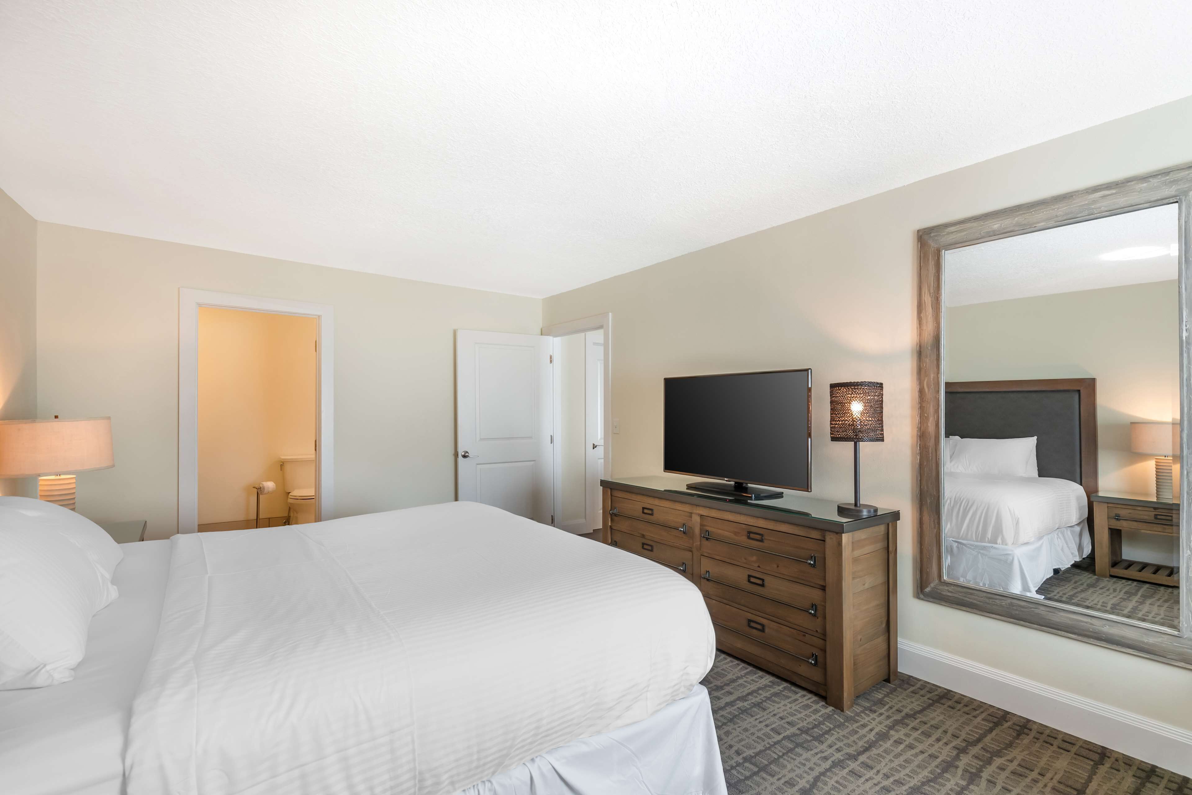 suite, 1 king bed, non smoking, refrigerator & microwave | premium bedding, desk, blackout curtains, iron/ironing board