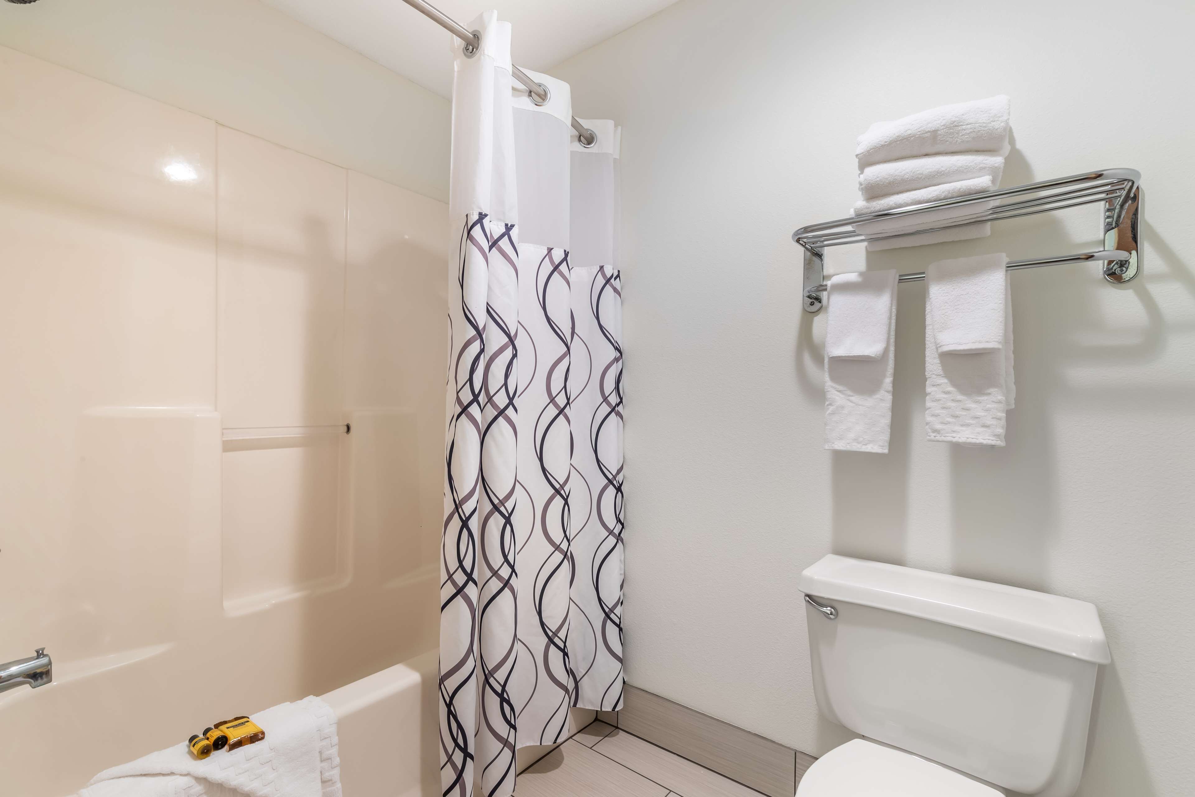 standard room, 2 queen beds, non smoking, refrigerator | bathroom | combined shower/bathtub, hair dryer, towels