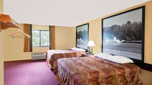 A hotel room with two beds, a large window with a view of a river and a boat, and a hanging coat rack. - Super 8 by Wyndham Iowa Falls (Iowa Falls)