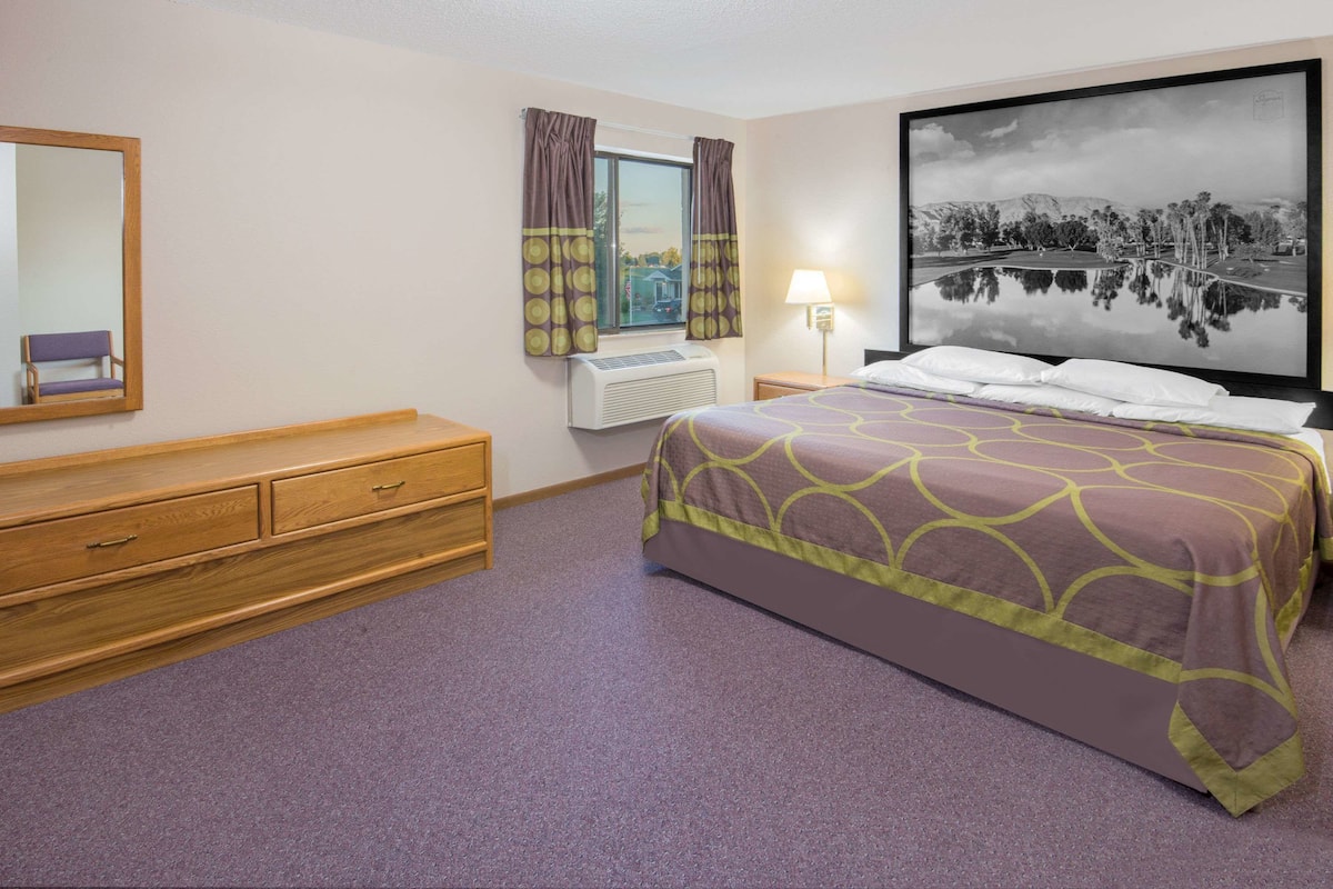 Premium bedding, desk, laptop workspace, blackout curtains