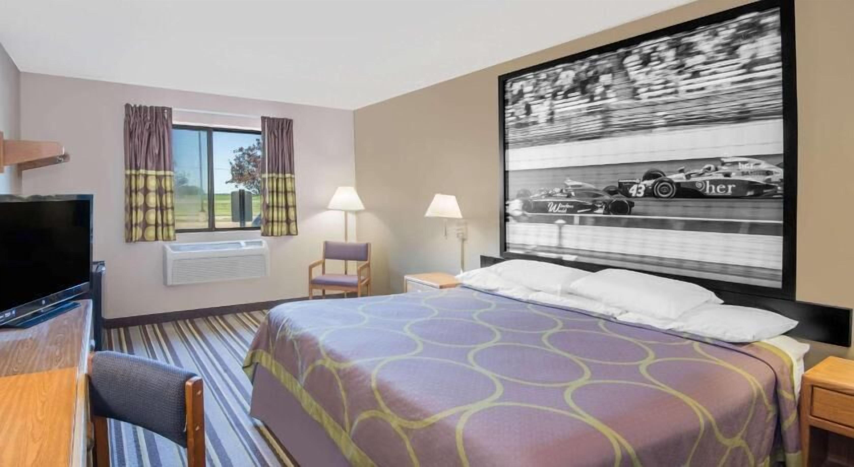 Premium bedding, desk, laptop workspace, blackout drapes