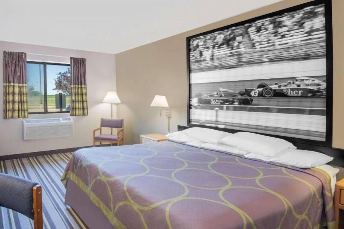 Premium bedding, desk, laptop workspace, blackout drapes