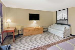 Premium bedding, desk, laptop workspace, blackout drapes