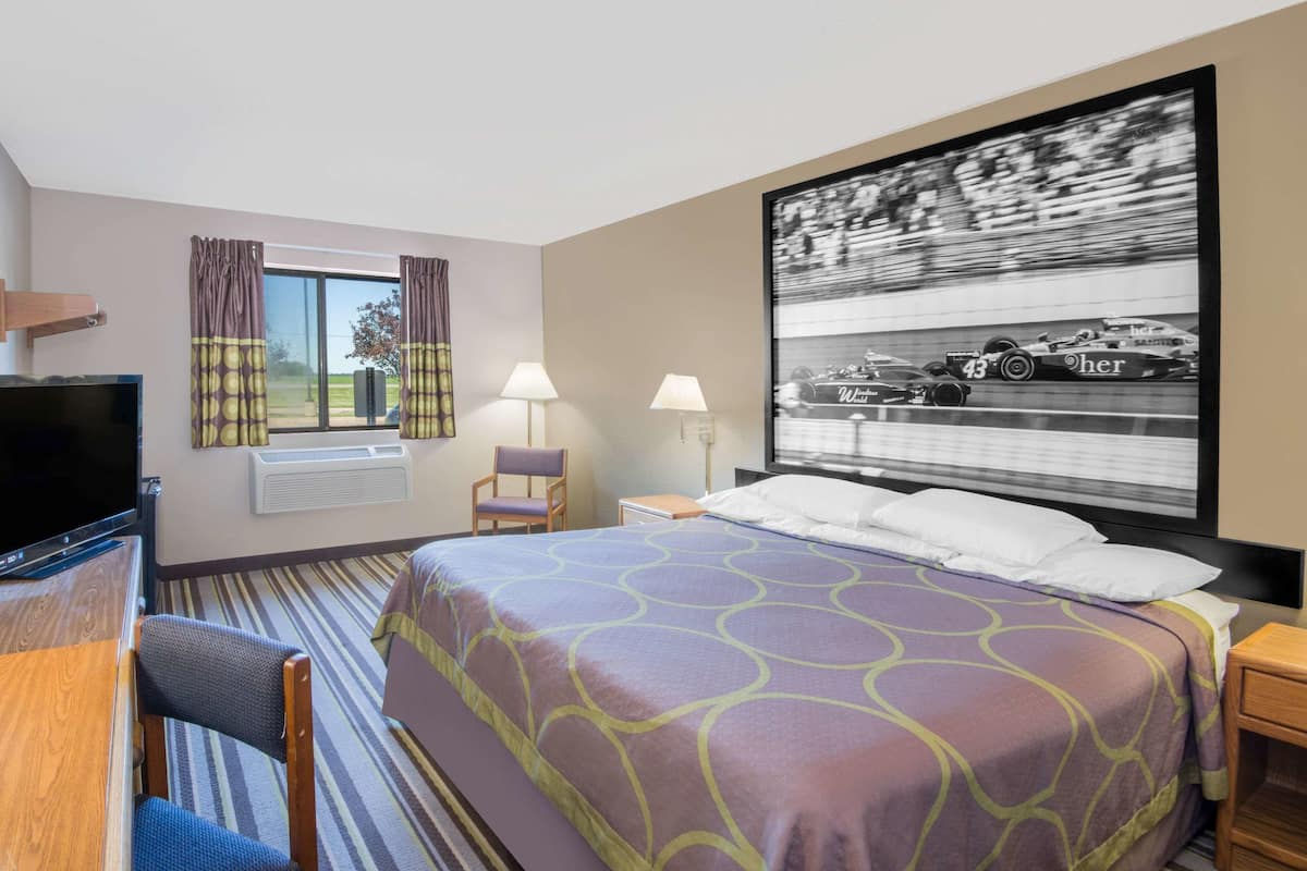 Premium bedding, desk, laptop workspace, blackout curtains