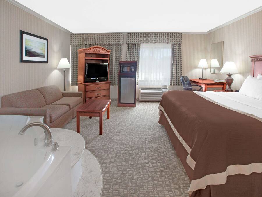 Suite, 1 King Bed, Non Smoking, Jetted Tub | Pillow-top beds, desk, laptop workspace, blackout curtains