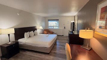 Desk, iron/ironing board, bed sheets, alarm clocks