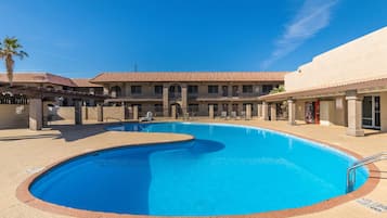 Outdoor pool, open 7:00 AM to 11:00 PM, pool loungers