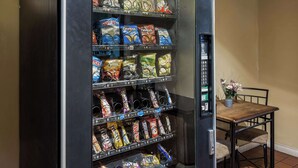 A vending machine stocked with various snacks and beverages. - Knights Inn Ashland (Ashland)