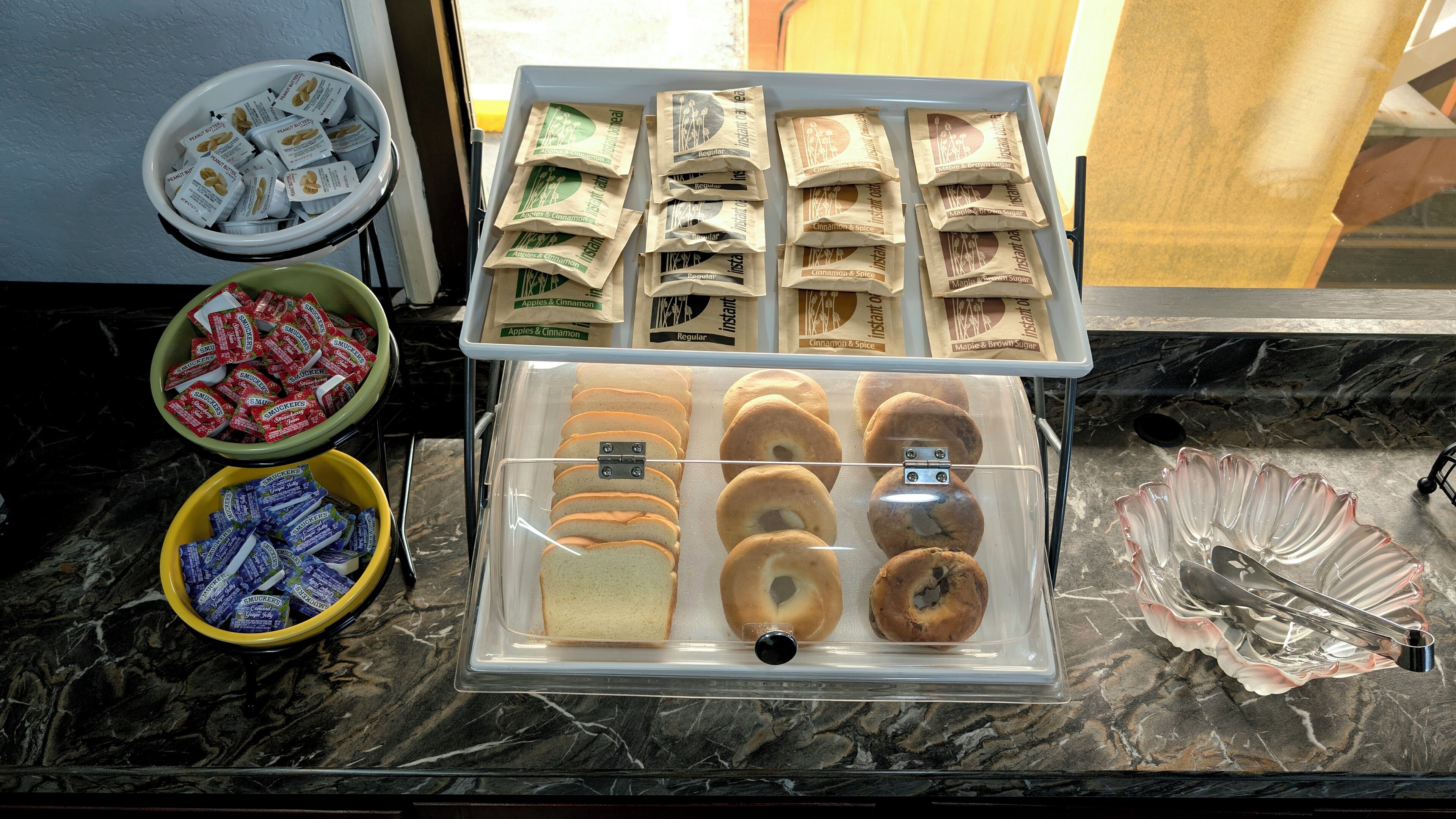 A bakery display with various pastries and packaged goods.