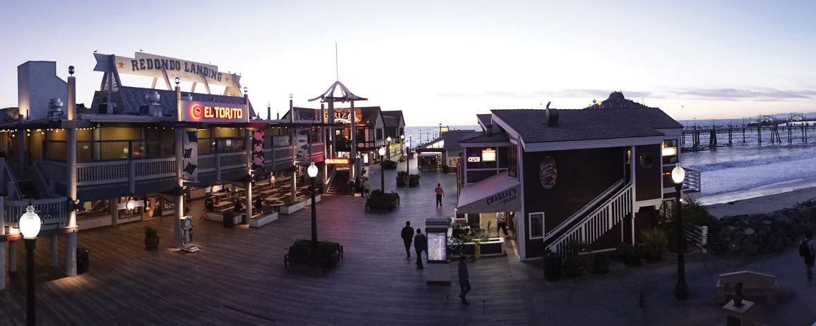 A boardwalk with shops and restaurants, including El Toro and Redondo Landing.