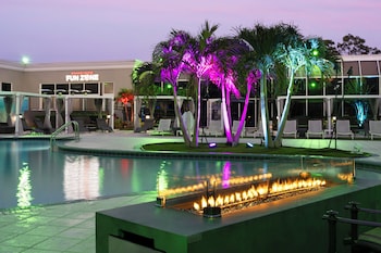 2 outdoor pools, open 8:00 AM to 11:00 PM, pool umbrellas, sun loungers at Holiday Inn Resort Kissimmee by the Parks by IHG