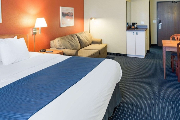 Suite, 1 King Bed, Non Smoking | In-room safe, desk, laptop workspace, iron/ironing board