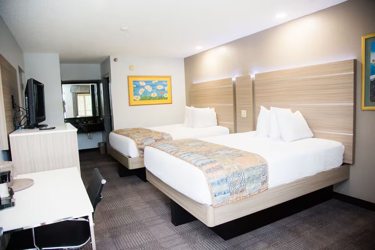 Room, 2 Queen Beds | In-room safe, iron/ironing board, free WiFi, bed sheets