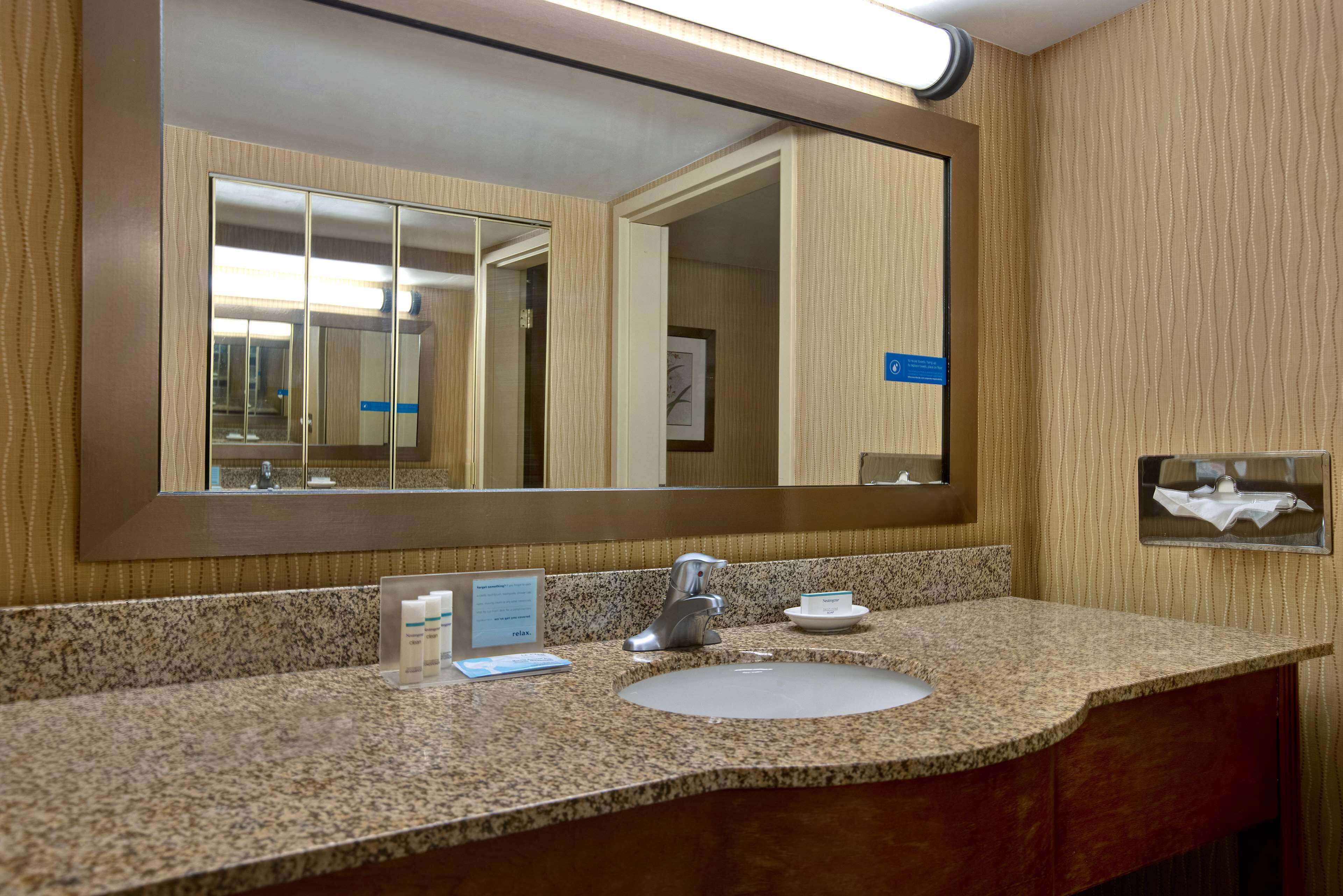 suite, 1 king bed, non smoking, refrigerator & microwave | bathroom | free toiletries, hair dryer, towels