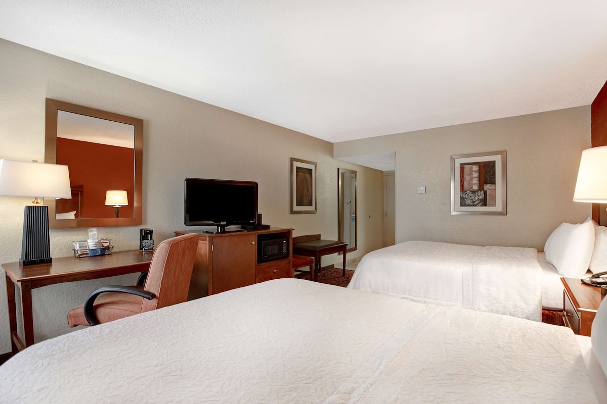 room, 2 queen beds, non smoking, refrigerator & microwave | in-room safe, blackout curtains, iron/ironing board