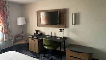 Premium bedding, desk, laptop workspace, blackout curtains