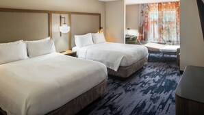 A hotel room with two beds, a desk, a chair, a small table, and a window with curtains. - Fairfield Inn by Marriott Richmond (New Paris)