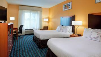 Premium bedding, desk, laptop workspace, blackout curtains