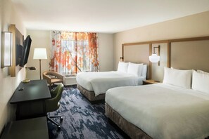 A hotel room with two beds, a desk, a chair, a lamp, and a window with curtains. - Fairfield Inn by Marriott Richmond (New Paris)