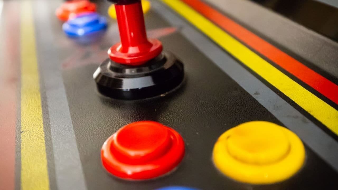 A control panel with buttons in red, yellow, and blue.