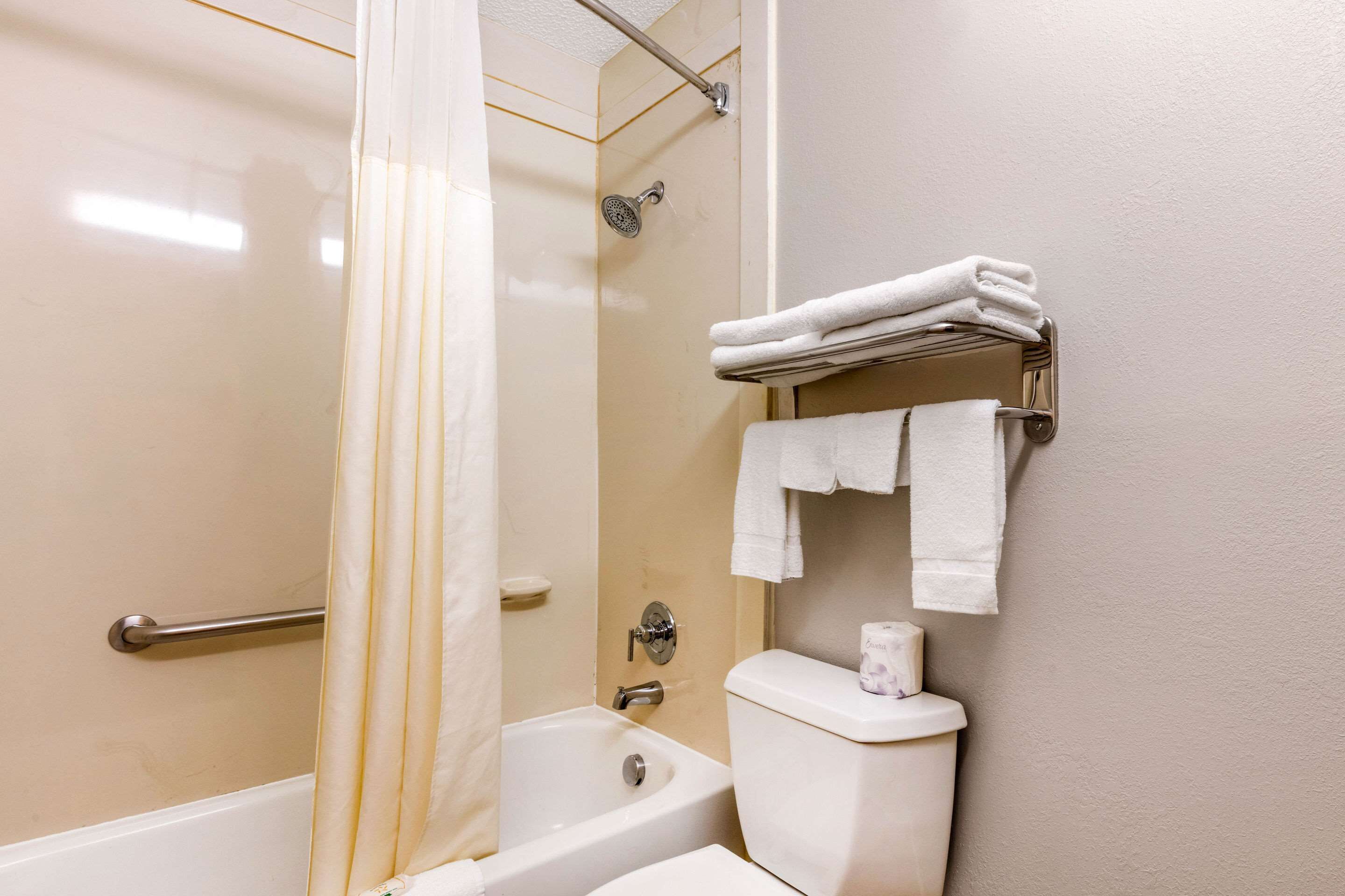 combined shower/bathtub, hair dryer, towels, soap