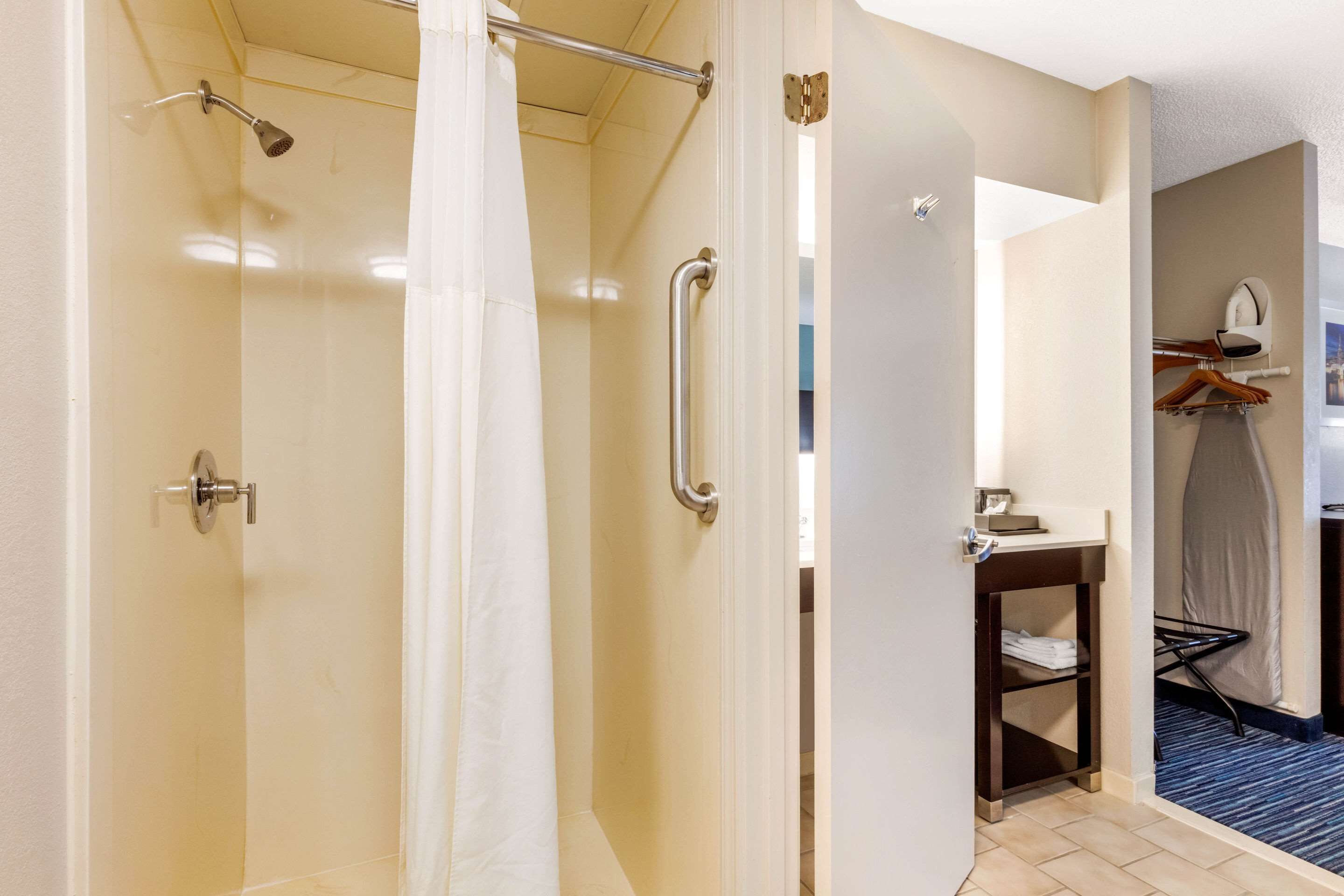 combined shower/bathtub, hair dryer, towels, soap