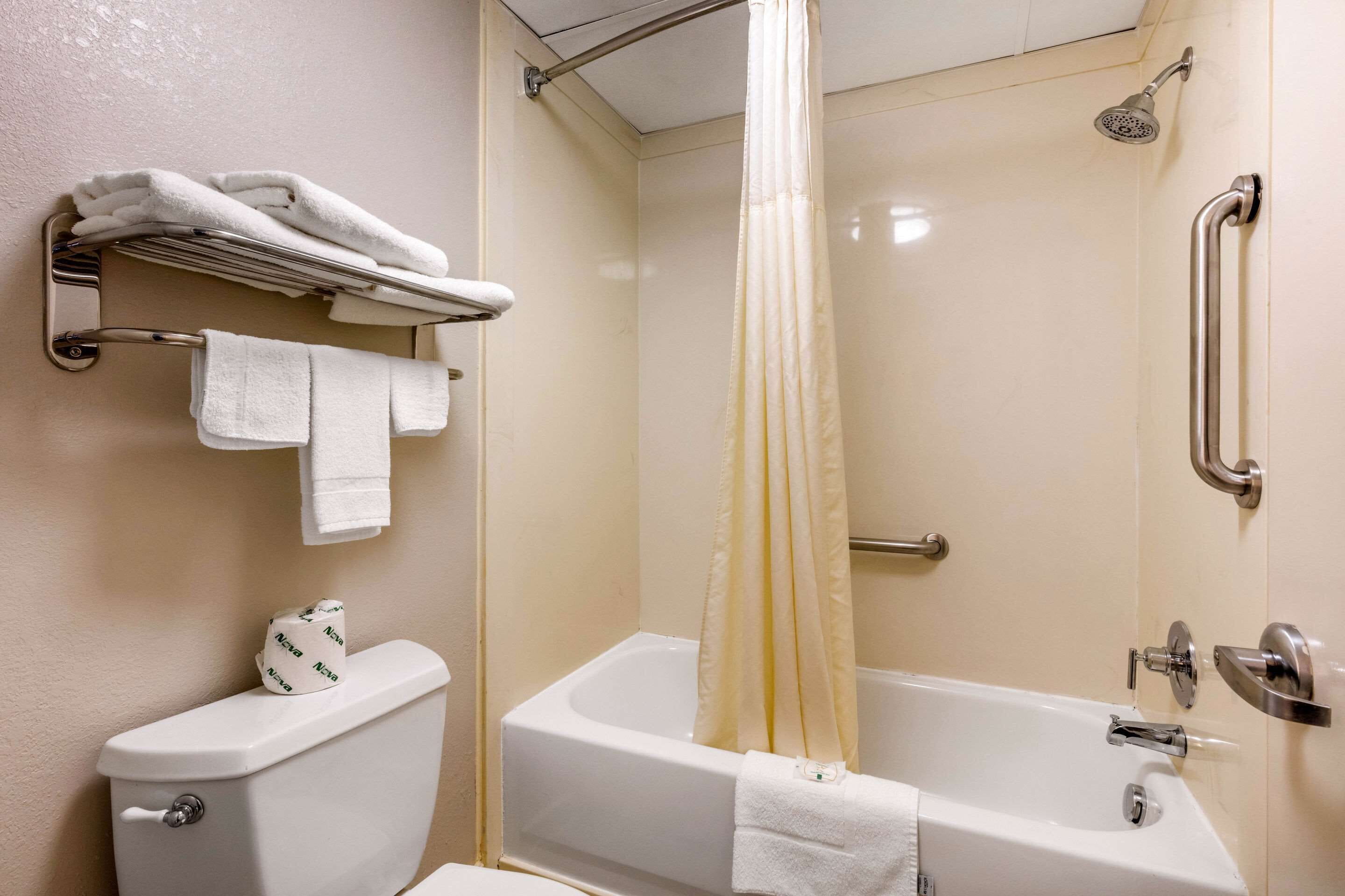 combined shower/bathtub, hair dryer, towels, soap