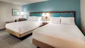 A hotel room with two beds, a nightstand, a lamp, and a framed picture on the wall. - Hampton Inn Lebanon (Lebanon)