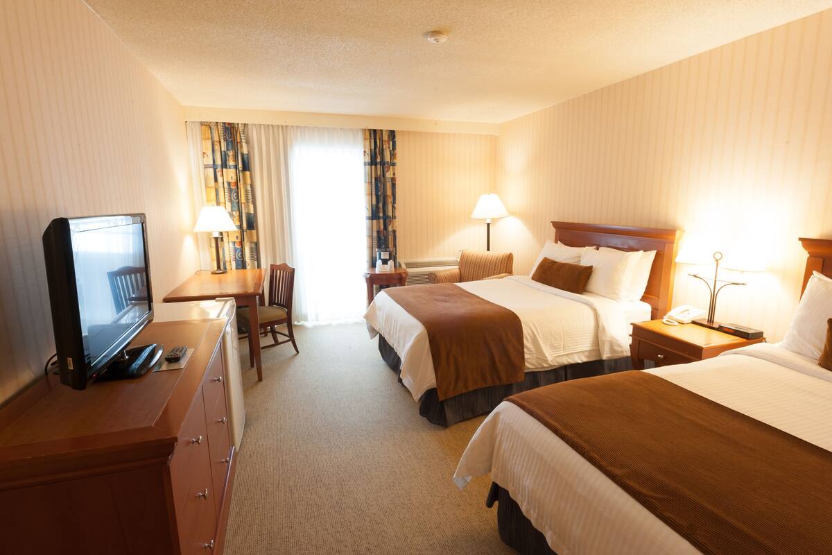 Premium bedding, pillowtop beds, desk, blackout drapes