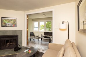 Premium Suite, Multiple Beds | Living area | 42-inch LCD TV with cable channels, TV, DVD player