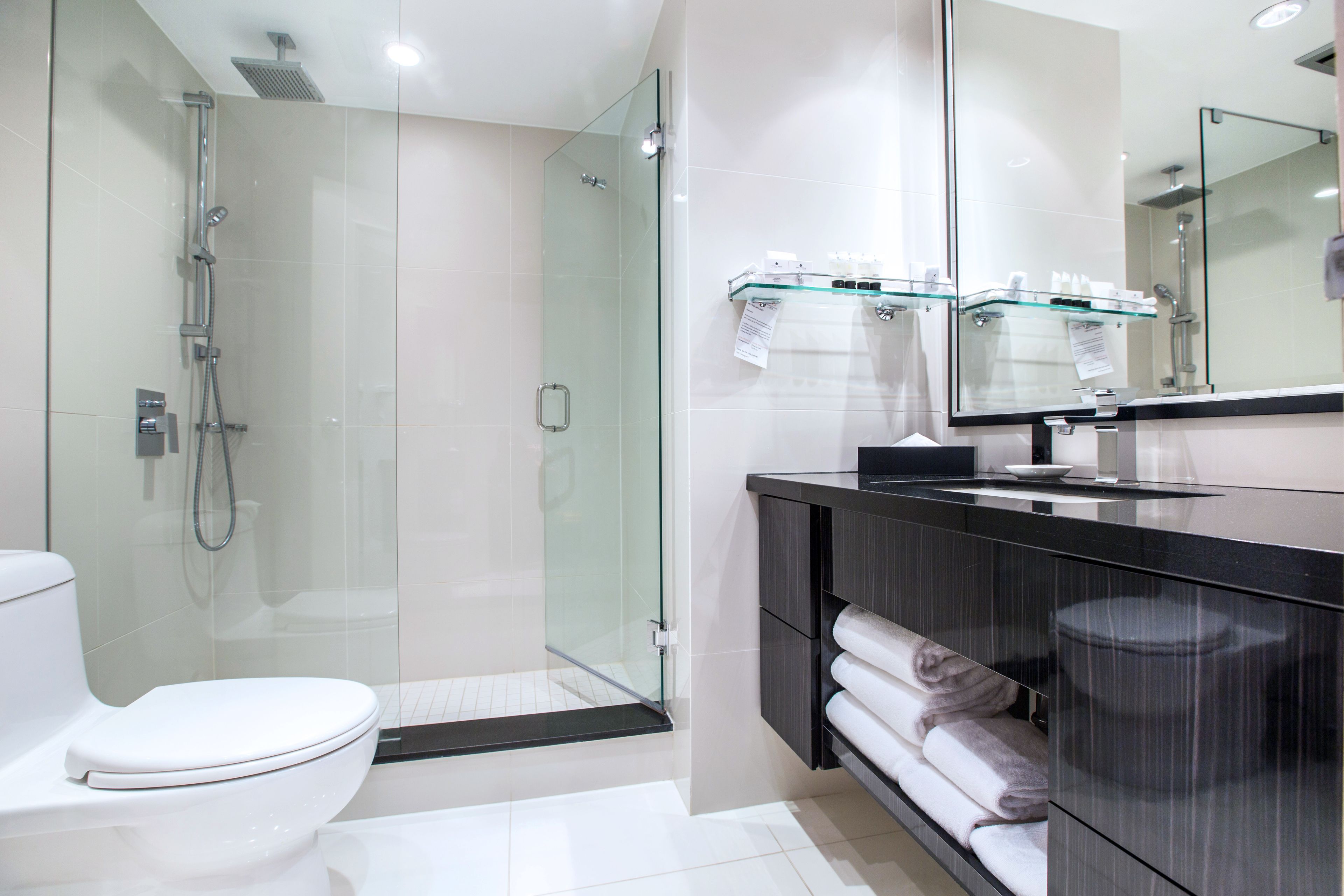 designer toiletries, hair dryer, towels, soap