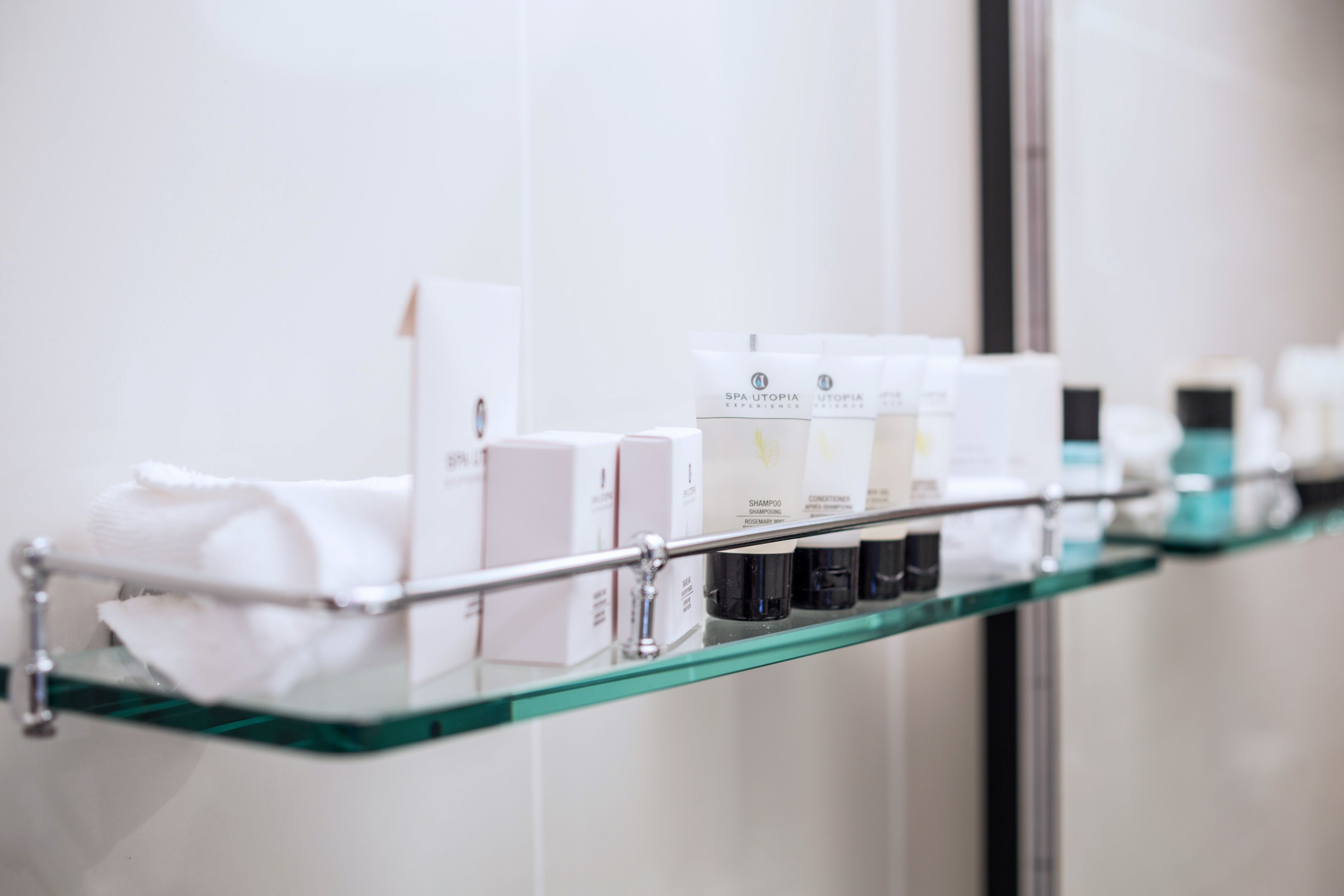 designer toiletries, hair dryer, towels, soap