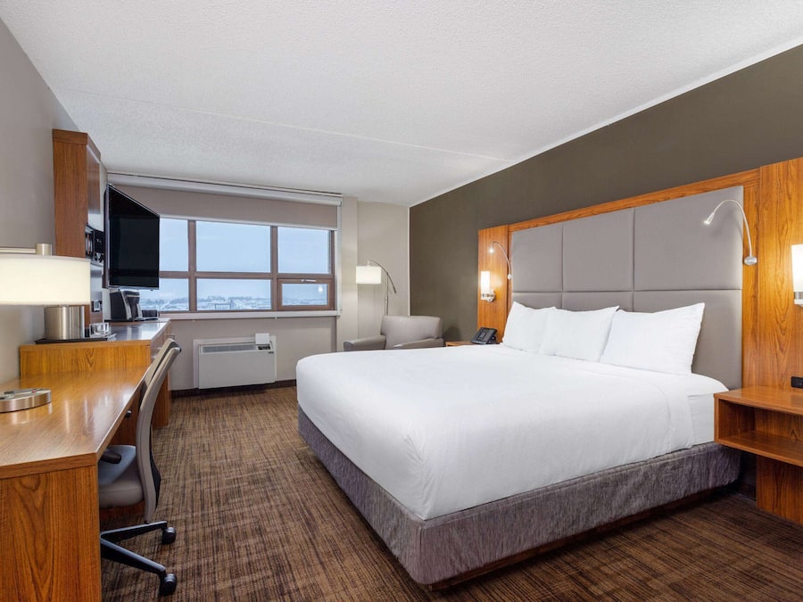 Hypo-allergenic bedding, desk, laptop workspace, blackout curtains