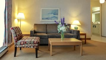 Economy Suite, 1 Bedroom | Living area | 52-inch LED TV with digital channels