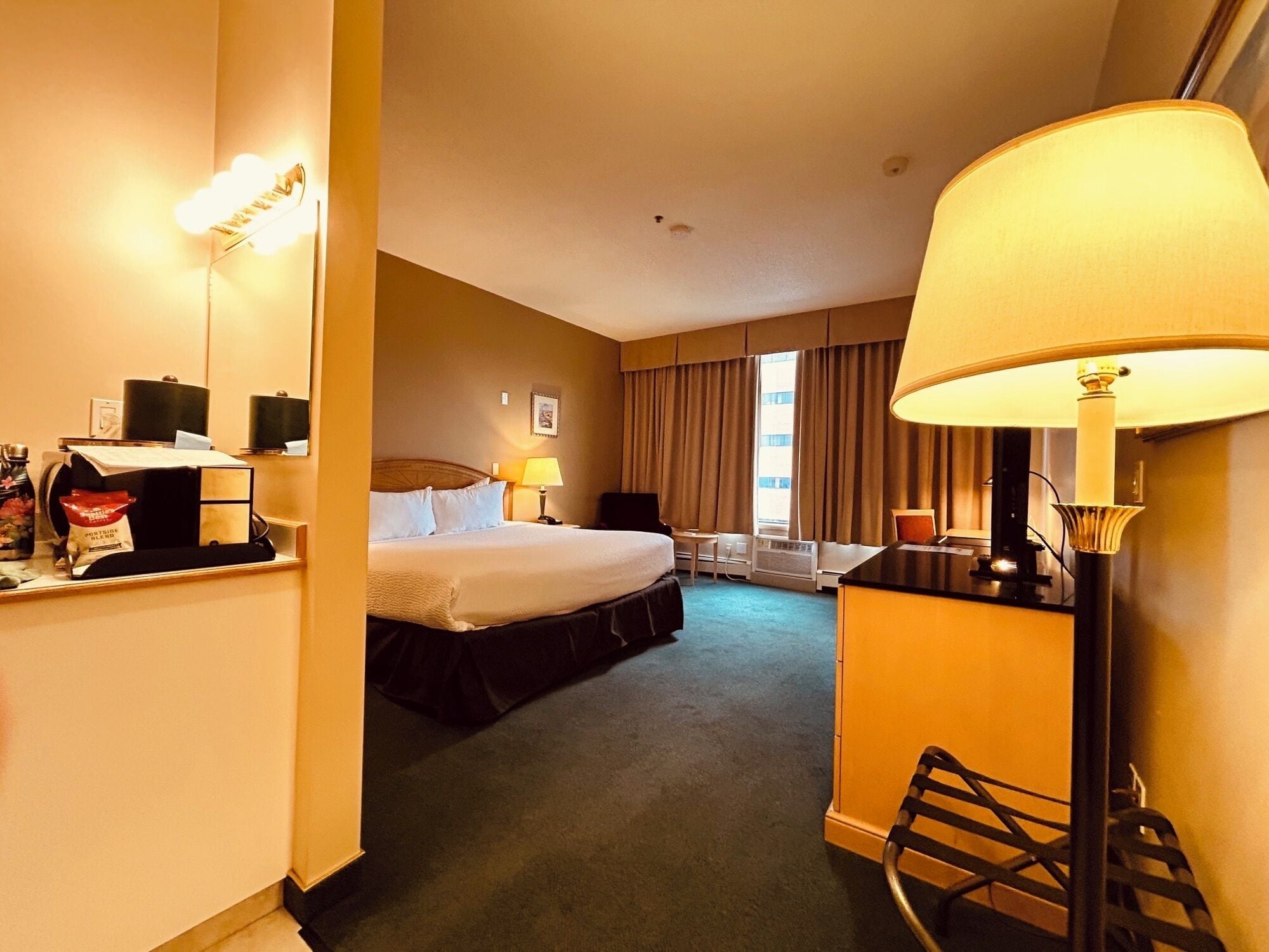 Hypo-allergenic bedding, laptop workspace, blackout drapes