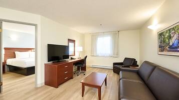 Suite, 1 Bedroom | Living area | 55-inch flat-screen TV with cable channels