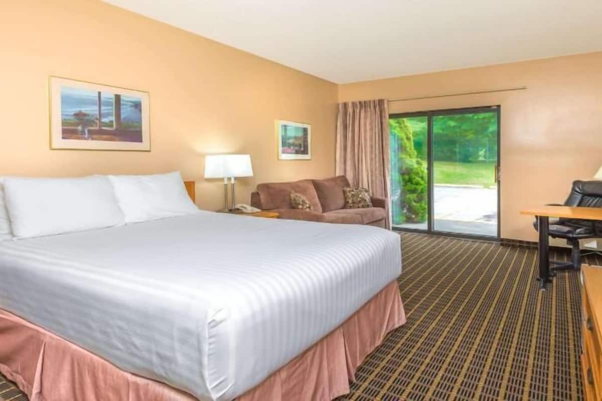 Laptop workspace, blackout drapes, iron/ironing board