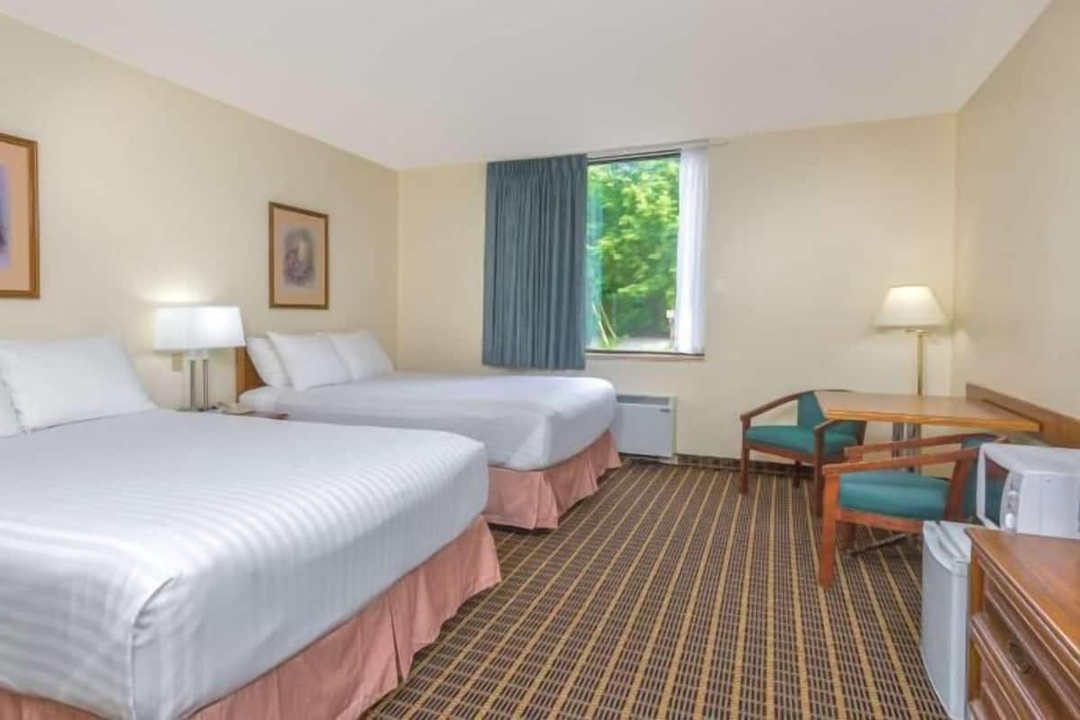 Laptop workspace, blackout drapes, iron/ironing board