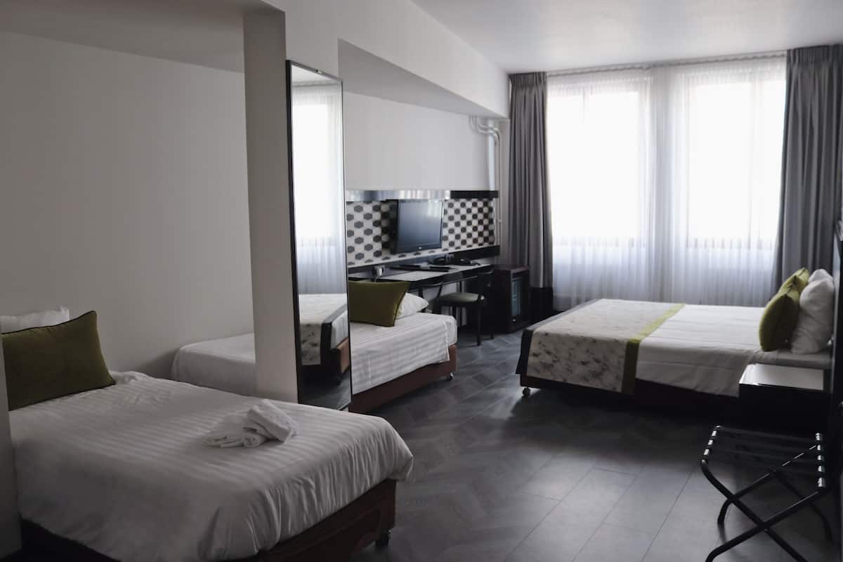 Executive Quadruple Room | 1 bedroom, in-room safe, desk, free WiFi