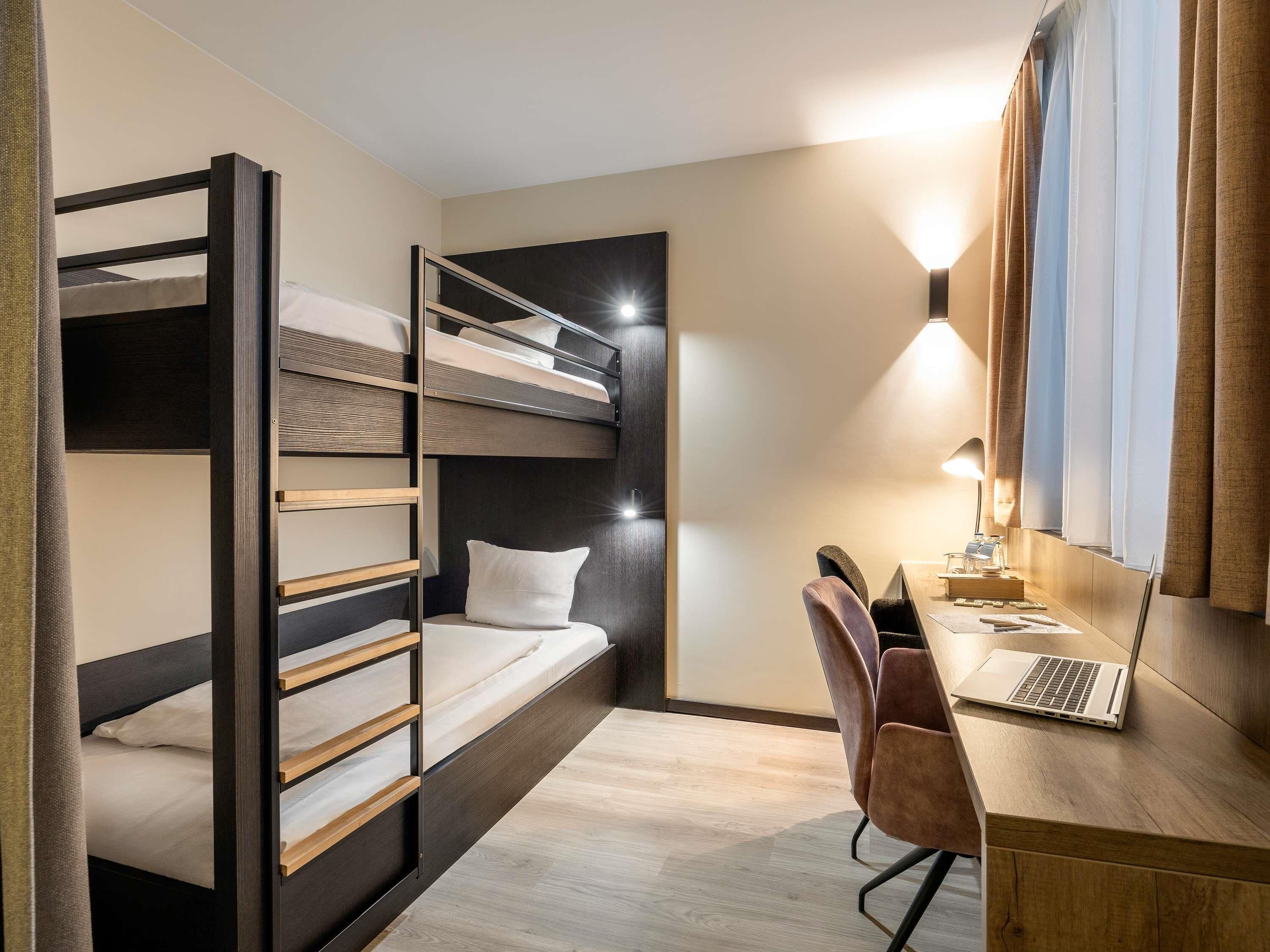 Family Room | In-room safe, desk, blackout drapes, iron/ironing board
