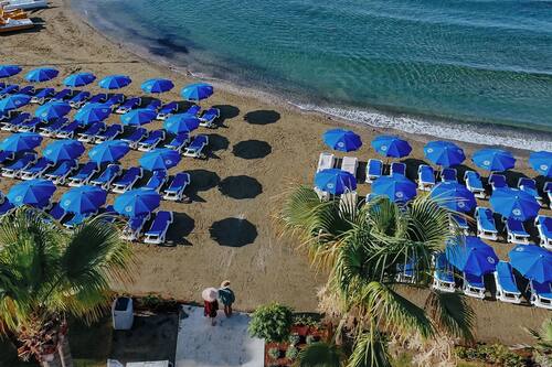 On the beach, sun-loungers, beach umbrellas, beach towels