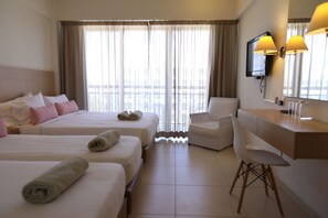 Standard Family Room | Minibar, in-room safe, laptop workspace, blackout drapes