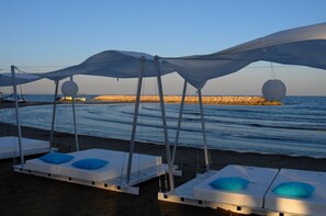 On the beach, sun loungers, beach umbrellas, beach towels