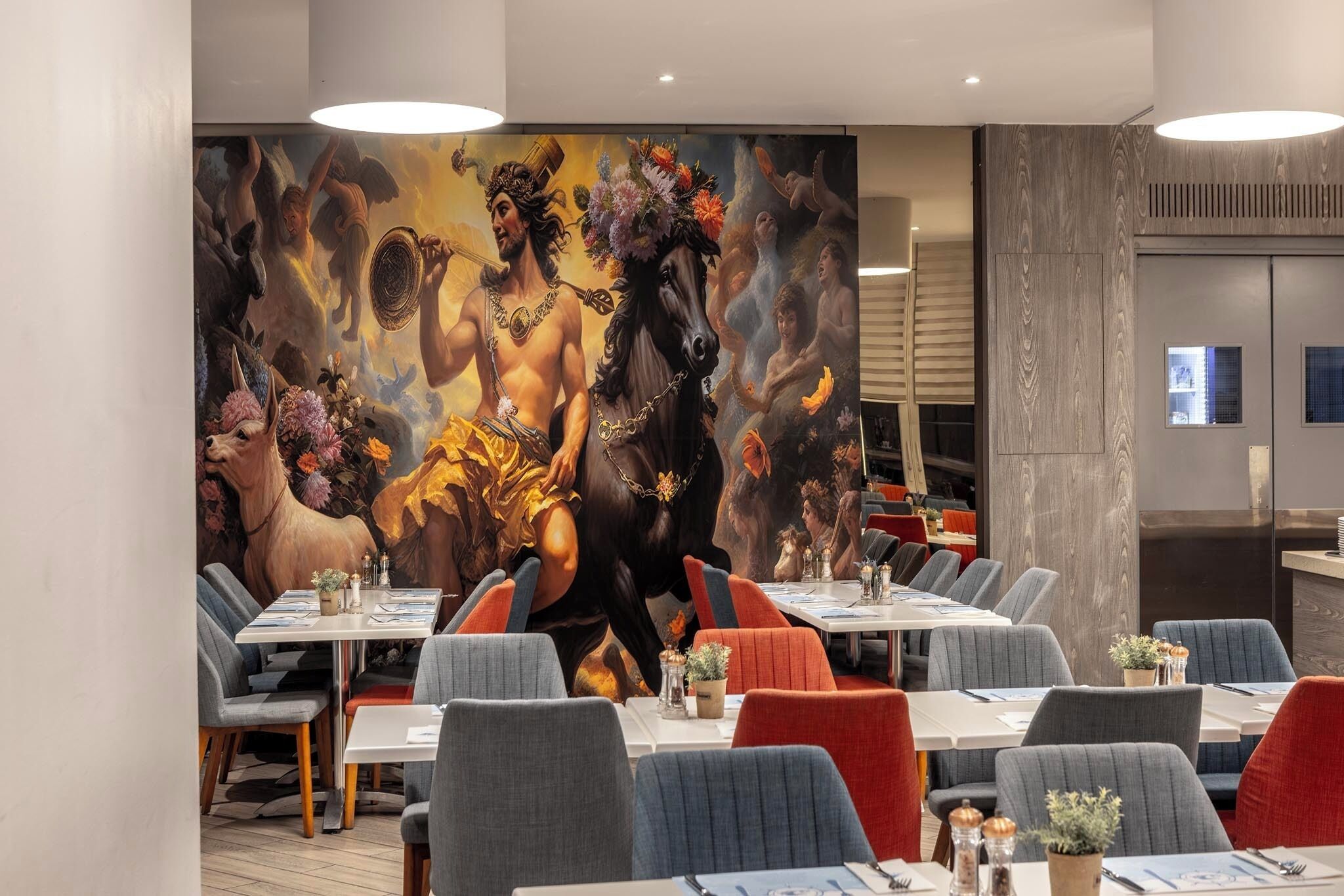 A restaurant with a mural of mythological figures and horses, modern seating, and a clean, contemporary design.