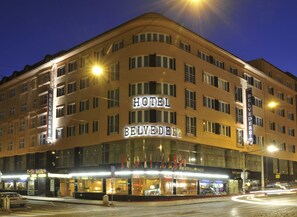 Hotel Belvedere features a modern architectural design with a flat roof and glass facade.