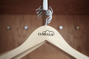 A wooden hanger with the text "CUMULUS" on it. - Cumulus Kuopio (Kuopio)